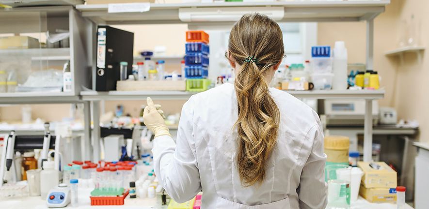 Woman wearing lab coat working in the laboratory